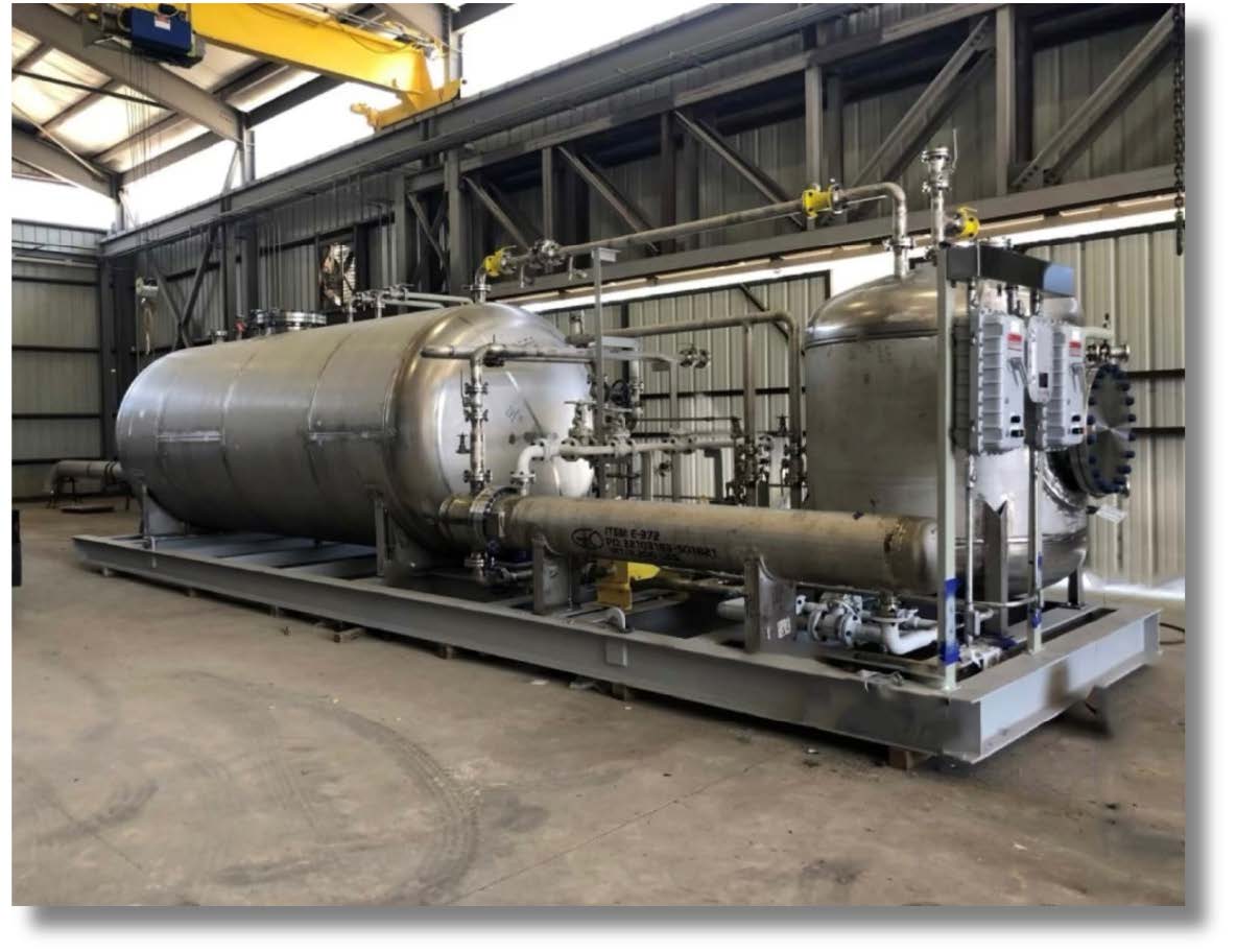 man inspecting interior of pressure vessel