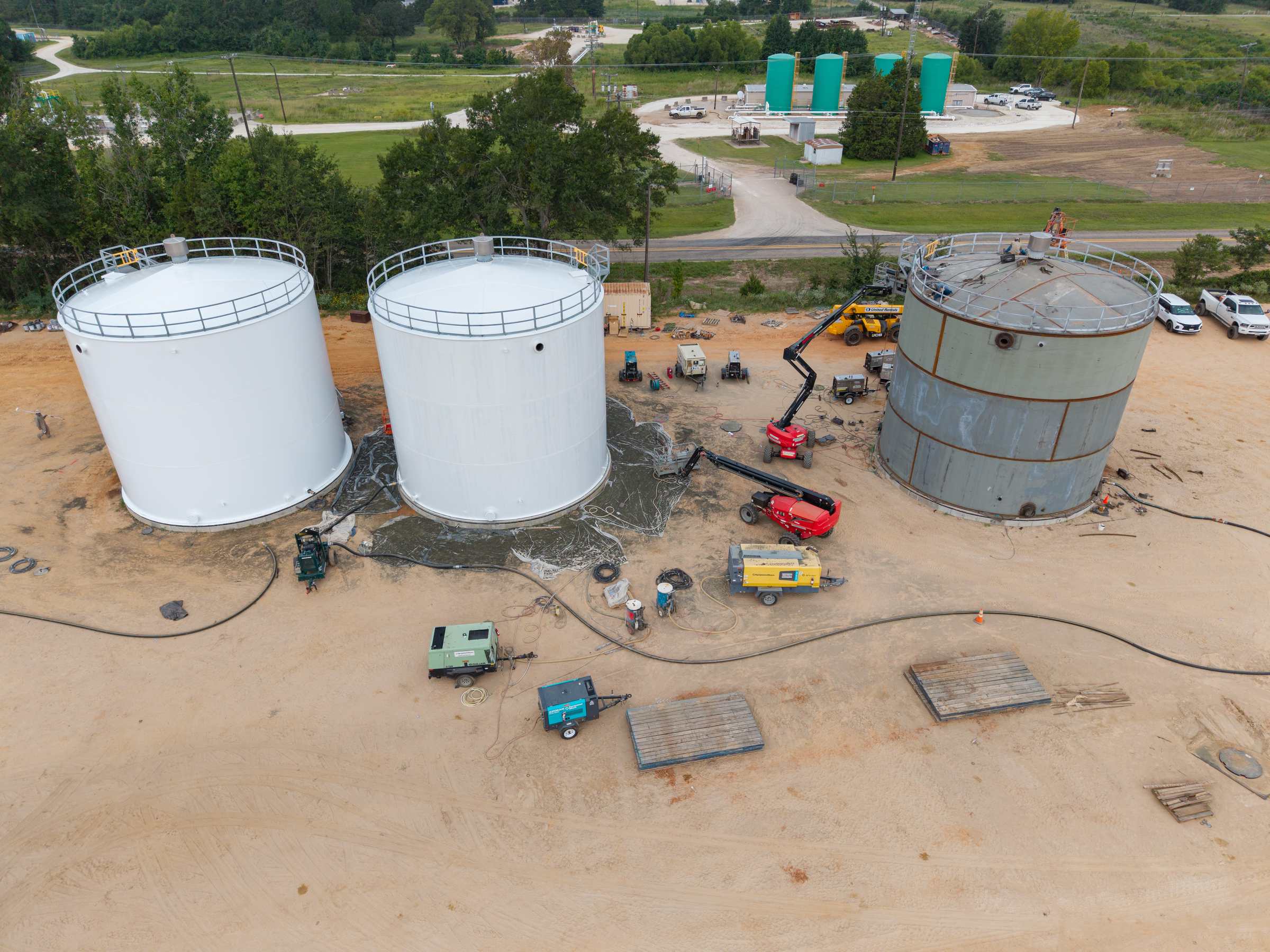 PALA crew constructing aboveground storage tanks at an industrial jobsite